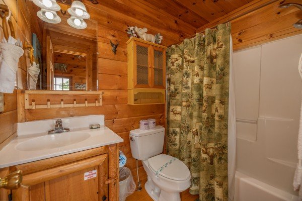 Bathroom with a tub and shower at Sweet Serenity, a 2 bedroom cabin rental located in Gatlinburg