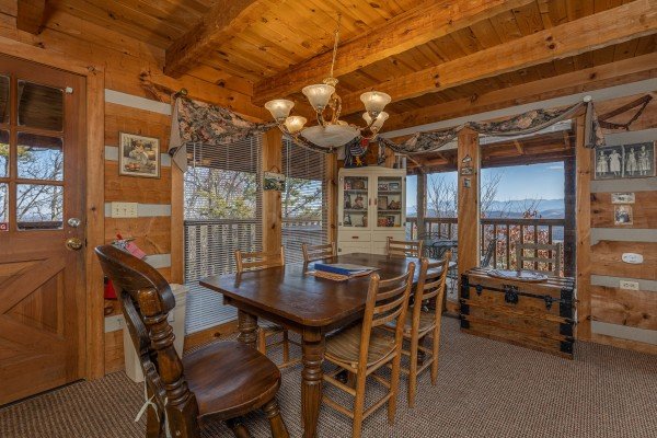 Dining room table with seating for six at Stellar View, a 1 bedroom cabin rental located in Pigeon Forge