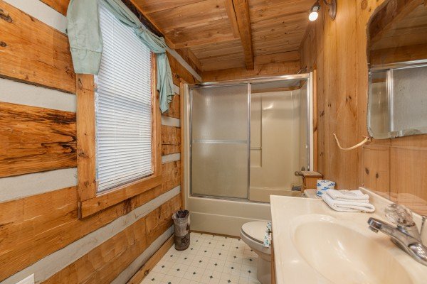 Bathroom with a tub and shower at Stellar View, a 1 bedroom cabin rental located in Pigeon Forge