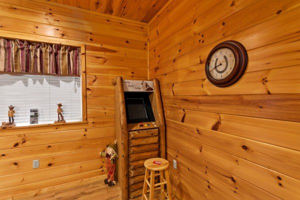 Arcade game at Rising Wolf Lodge, a 3 bedroom cabin rental located in Pigeon Forge