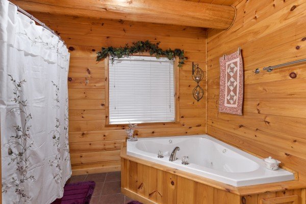 Jacuzzi in a bathroom at Rising Wolf Lodge, a 3 bedroom cabin rental located in Pigeon Forge