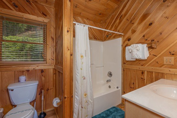Bathroom with a tub and shower at Kaleidoscope, a 2 bedroom cabin rental located in Pigeon Forge