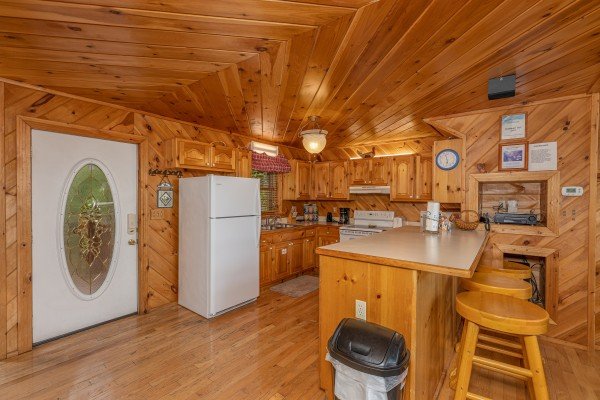 Kitchen with white appliances at Kaleidoscope, a 2 bedroom cabin rental located in Pigeon Forge