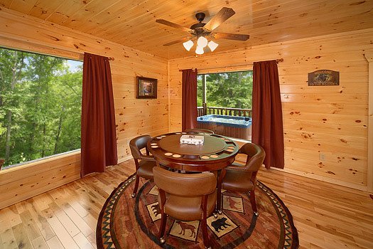 Executive card table with four chairs in the game room at Big Bear Cub House, a 1-bedroom cabin rental located in Gatlinburg