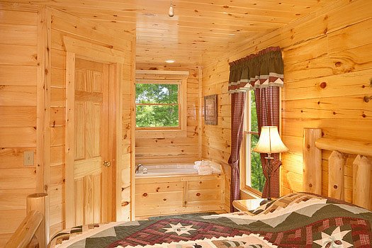 Jacuzzi tub in master bedroom at Big Bear Cub House, a 1-bedroom cabin rental located in Gatlinburg