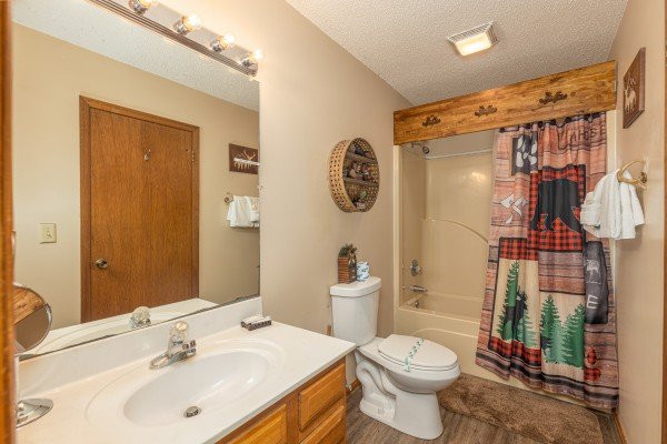Bathroom with a tub and shower at Magic Moments, a 2 bedroom cabin rental located in Pigeon Forge