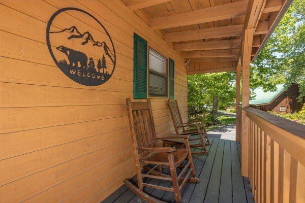 Front porch with rocking chairs at Magic Moments, a 2 bedroom cabin rental located in Pigeon Forge
