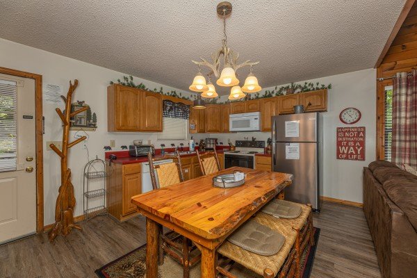 Kitchen with dining space at Magic Moments, a 2 bedroom cabin rental located in Pigeon Forge