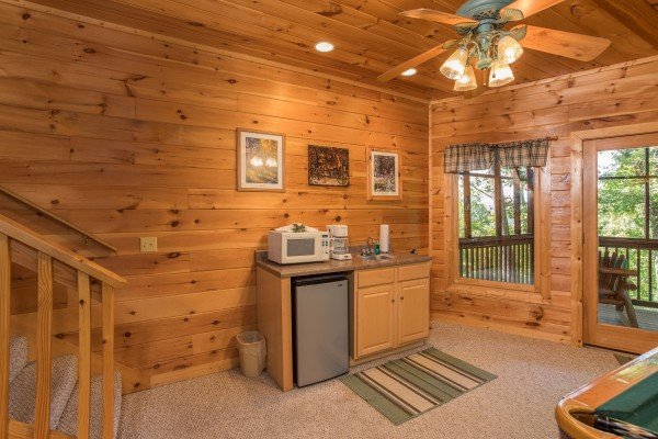 Kitchenette with a mini fridge, microwave, and cabinet at Friends in High Places, a 4-bedroom cabin rental located in Pigeon Forge