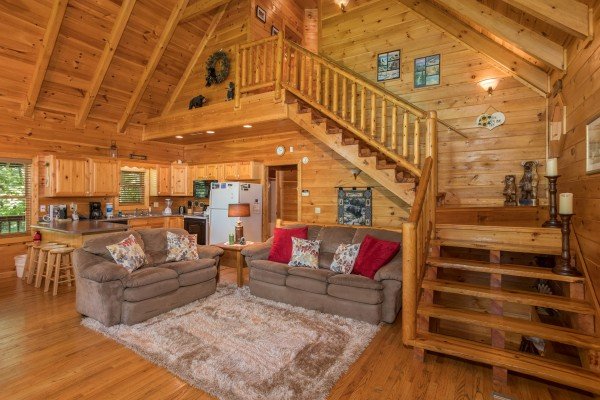 Living room with sofa and loveseat at Friends in High Places, a 4-bedroom cabin rental located in Pigeon Forge