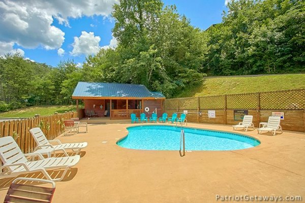 Guests at Howlin' in the Smokies, a 2 bedroom cabin rental located in Pigeon Forge have access to the pool at Starr Crest Resort