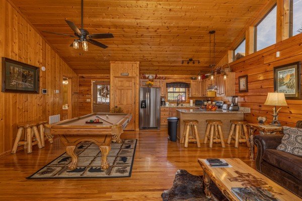 Pool table and kitchen at Close at Heart, a 1 bedroom cabin rental located in Pigeon Forge