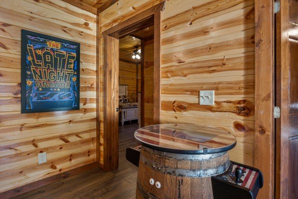 Arcade game table at Mountain Joy, an 8 bedroom cabin rental located in Pigeon Forge