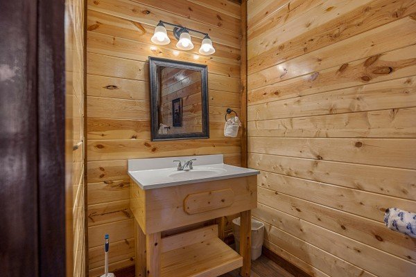 Bathroom with door at Mountain Joy, an 8 bedroom cabin rental located in Pigeon Forge