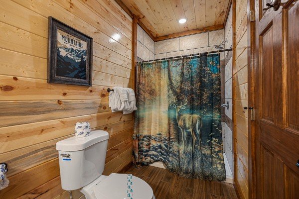 Bathroom with shower at Mountain Joy, an 8 bedroom cabin rental located in Pigeon Forge