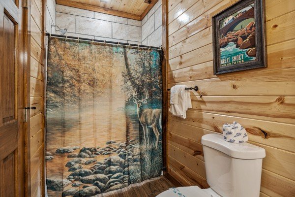 Bathroom with deer shower curtain at Mountain Joy, an 8 bedroom cabin rental located in Pigeon Forge