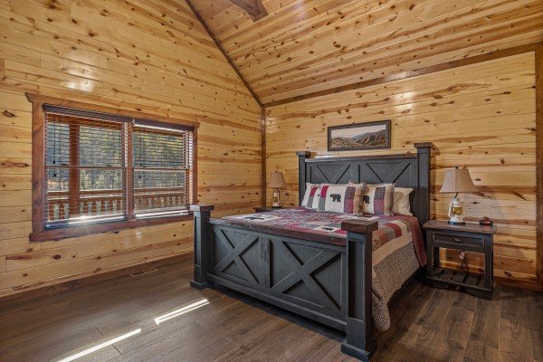 King bedroom with quilt and decor at Mountain Joy, an 8 bedroom cabin rental located in Pigeon Forge