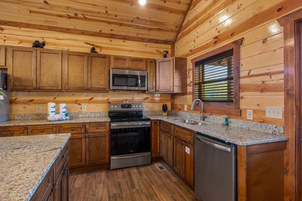 Kitchen with Island at Mountain Joy, an 8 bedroom cabin rental located in Pigeon Forge