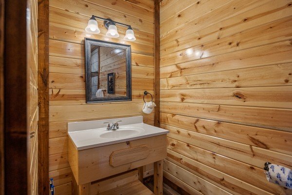Bathroom sink and lighting at Mountain Joy, an 8 bedroom cabin rental located in Pigeon Forge