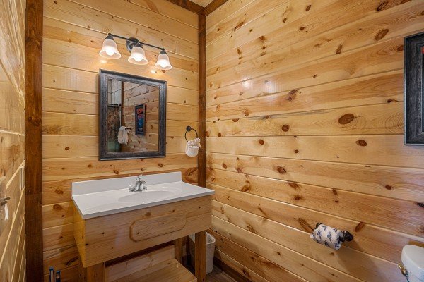 Bathroom sink and lighting at Mountain Joy, an 8 bedroom cabin rental located in Pigeon Forge