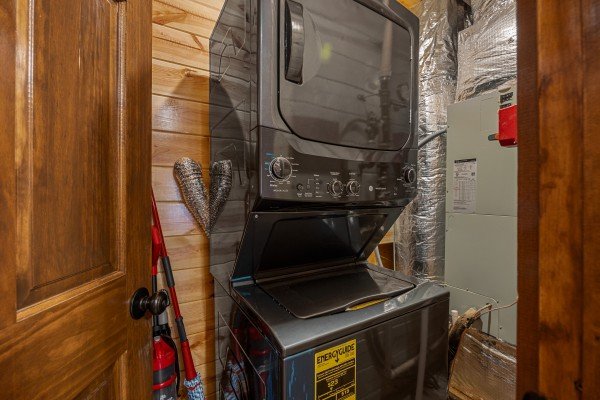 Washer and dryer combo at Mountain Joy, an 8 bedroom cabin rental located in Pigeon Forge