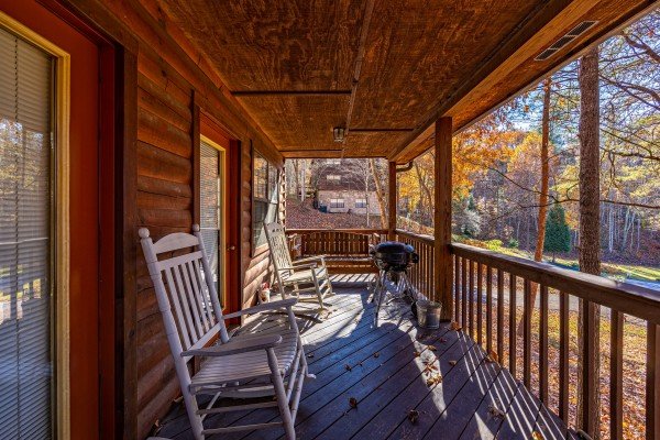 Rocking chairs on the deck at Oakwood, a 1 bedroom cabin rental located in Pigeon Forge