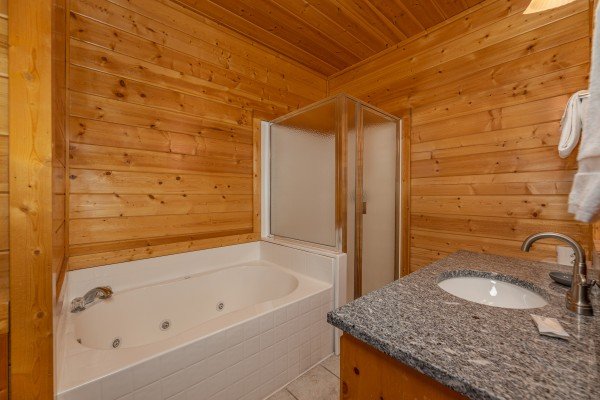 Jacuzzi in a bathroom at Grizzly's Den, a 5 bedroom cabin rental located in Gatlinburg