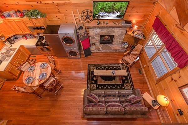 Looking at the living room at Bear Hug Hideaway, a 1-bedroom cabin rental located in Pigeon Forge