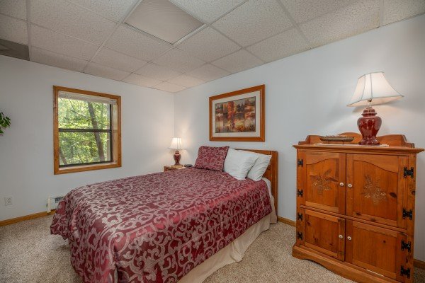 Bedroom with armoire at One Blessed Nest, a 3 bedroom cabin rental located in Pigeon Forge