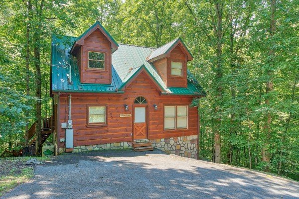 Exterior and parking area at Swept Away in the Smokies, a 1 bedroom cabin rental located in Pigeon Forge