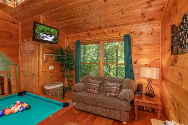 Game room with pool table and TV at Swept Away in the Smokies, a 1 bedroom cabin rental located in Pigeon Forge