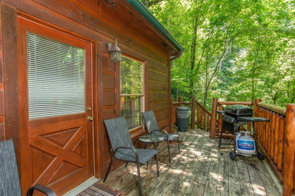 Grill on a deck at Swept Away in the Smokies, a 1 bedroom cabin rental located in Pigeon Forge