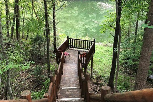 Smaller deck overlooking the stream at Swept Away in the Smokies, a 1 bedroom cabin rental located in Pigeon Forge
