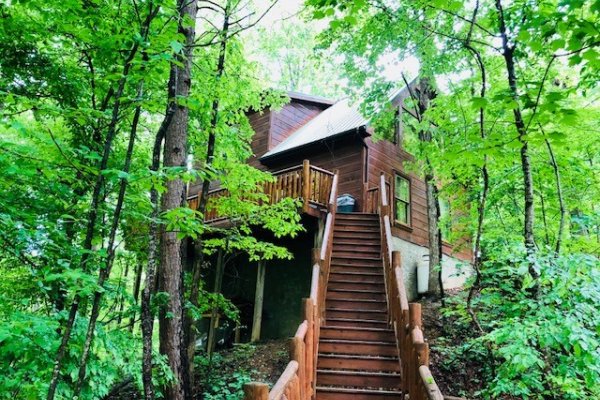 Stairs up from the lower deck at Swept Away in the Smokies, a 1 bedroom cabin rental located in Pigeon Forge