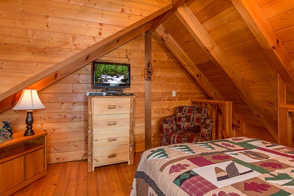 Television and dresser in the loft at Eagle's View Lodge, a 3-bedroom cabin rental located in Gatlinburg