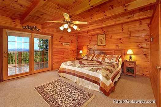 Main floor bedroom with king sized bed at Eagle's View Lodge, a 3-bedroom cabin rental located in Gatlinburg