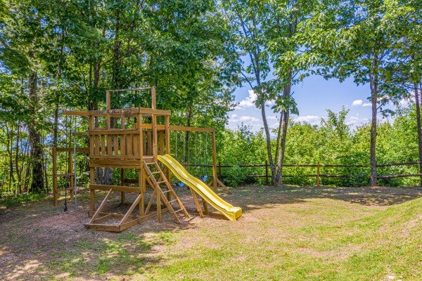 Swingset in the yard at Eagles View Lodge, a 3 bedroom cabin rental located in Gatlinburg