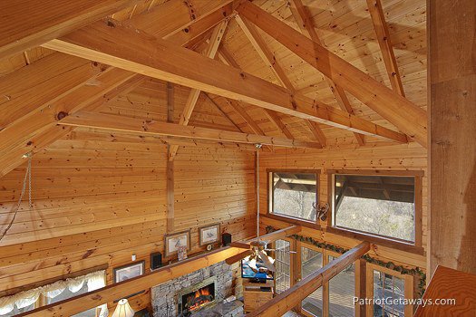 Wood beams supporting the room seen from the lofted bedroom at Eagle's View Lodge, a 3-bedroom cabin rental located in Gatlinburg