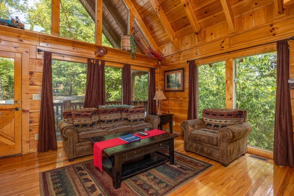 Living room seating at The Great Outdoors, a 3 bedroom cabin rental located in Pigeon Forge