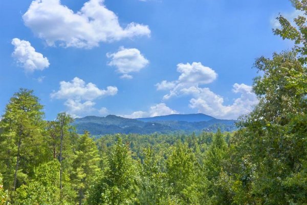 Mountains framed by trees at Wagon Wheel Cabin, a 3 bedroom cabin rental located in Pigeon Forge