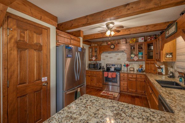 Kitchen with stainless appliances at Lazy Bear Retreat, a 4 bedroom cabin rental located in Pigeon Forge