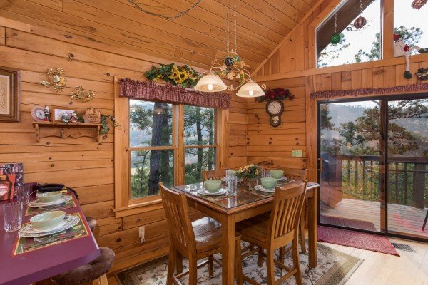 Dining table for four at R & R Hideaway, a 1 bedroom cabin rental located in Pigeon Forge