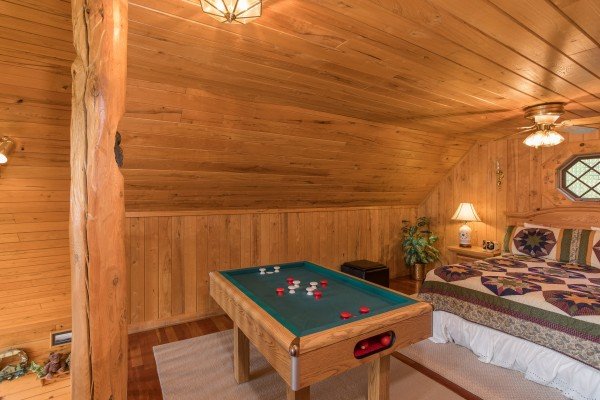 Bumper pool in the loft at R & R Hideaway, a 1 bedroom cabin rental located in Pigeon Forge