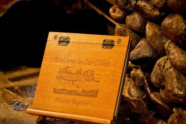 Custom wood cover on the guest book at Bear's Lair, a 2-bedroom cabin rental located in Pigeon Forge
