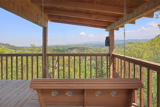 Deck swing at Bare Hugs, a 1-bedroom cabin rental located in Pigeon Forge