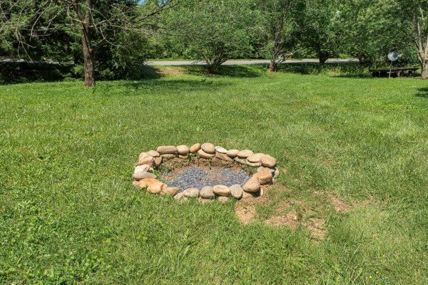 Fire pit in the yard at Grill & Chill, a 2-bedroom Gatlinburg cabin rental