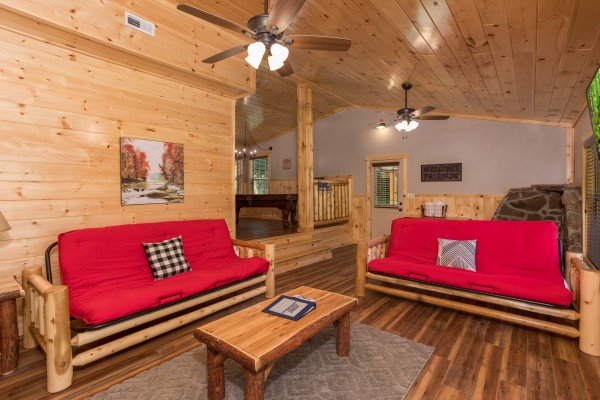 Living room with two futons at Grill & Chill, a 2-bedroom Gatlinburg cabin rental