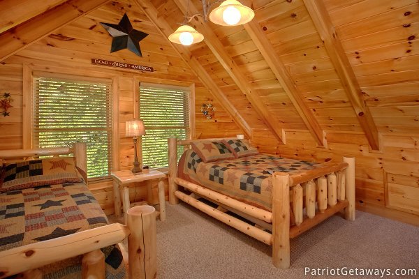 Couple of queen beds in the loft at Alpine Sundance Trail, a 3 bedroom cabin rental located in Pigeon Forge