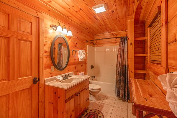 Bathroom with a tub and shower at Bearfoot Paradise, a 3-bedroom cabin rental located in Pigeon Forge