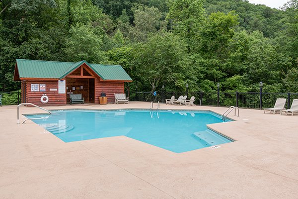 Pool and outbuilding at Bearfoot Paradise, a 3-bedroom cabin rental located in Pigeon Forge